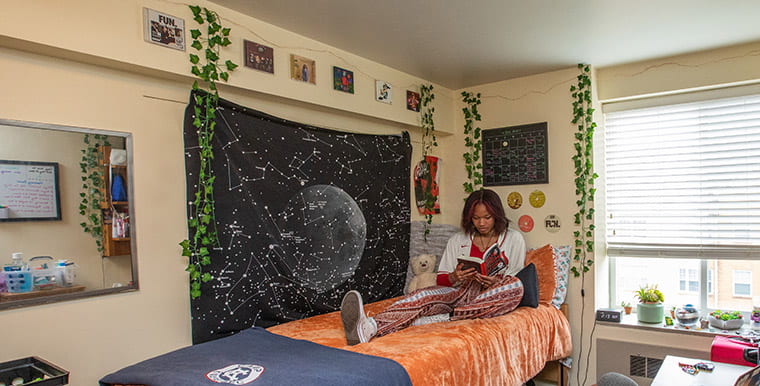 Student in residence hall room
